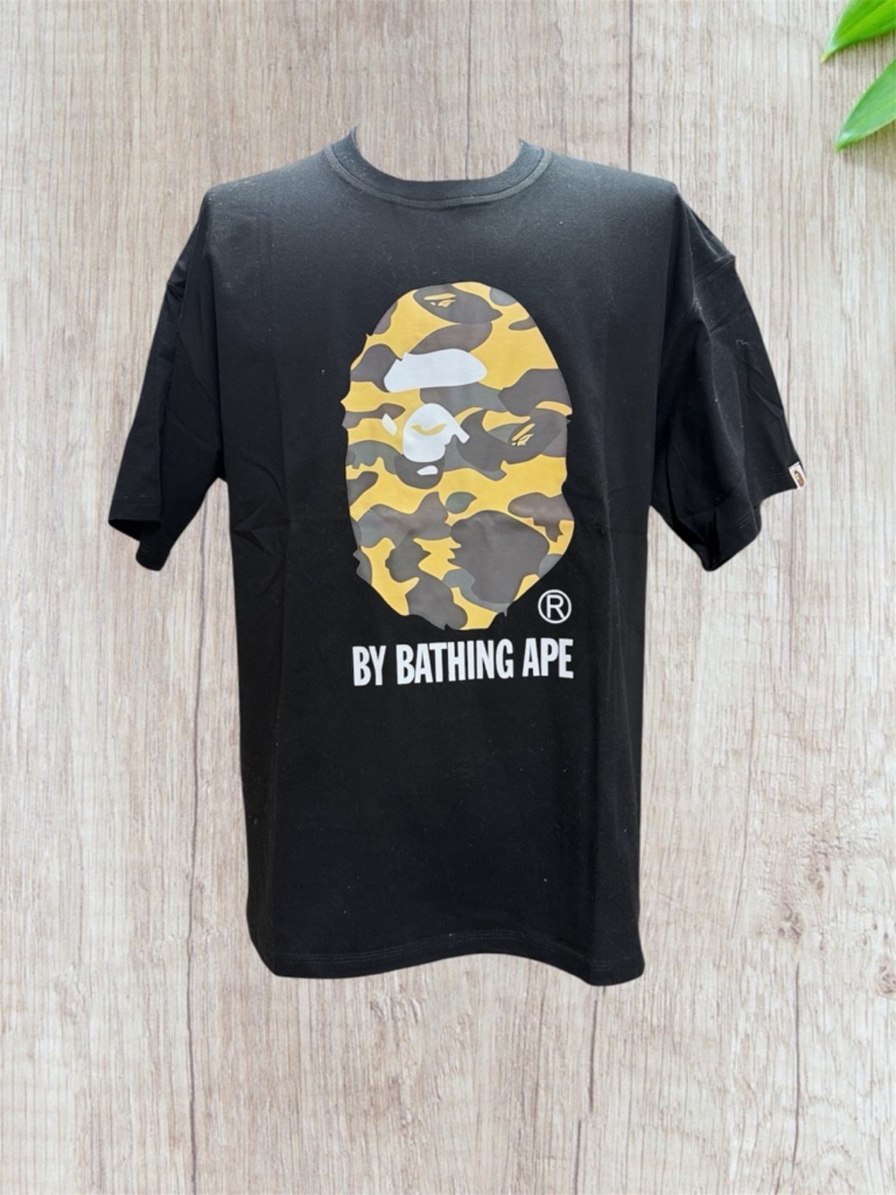 A Bathing Ape Black Tee with Yellow Camo Ape Logo